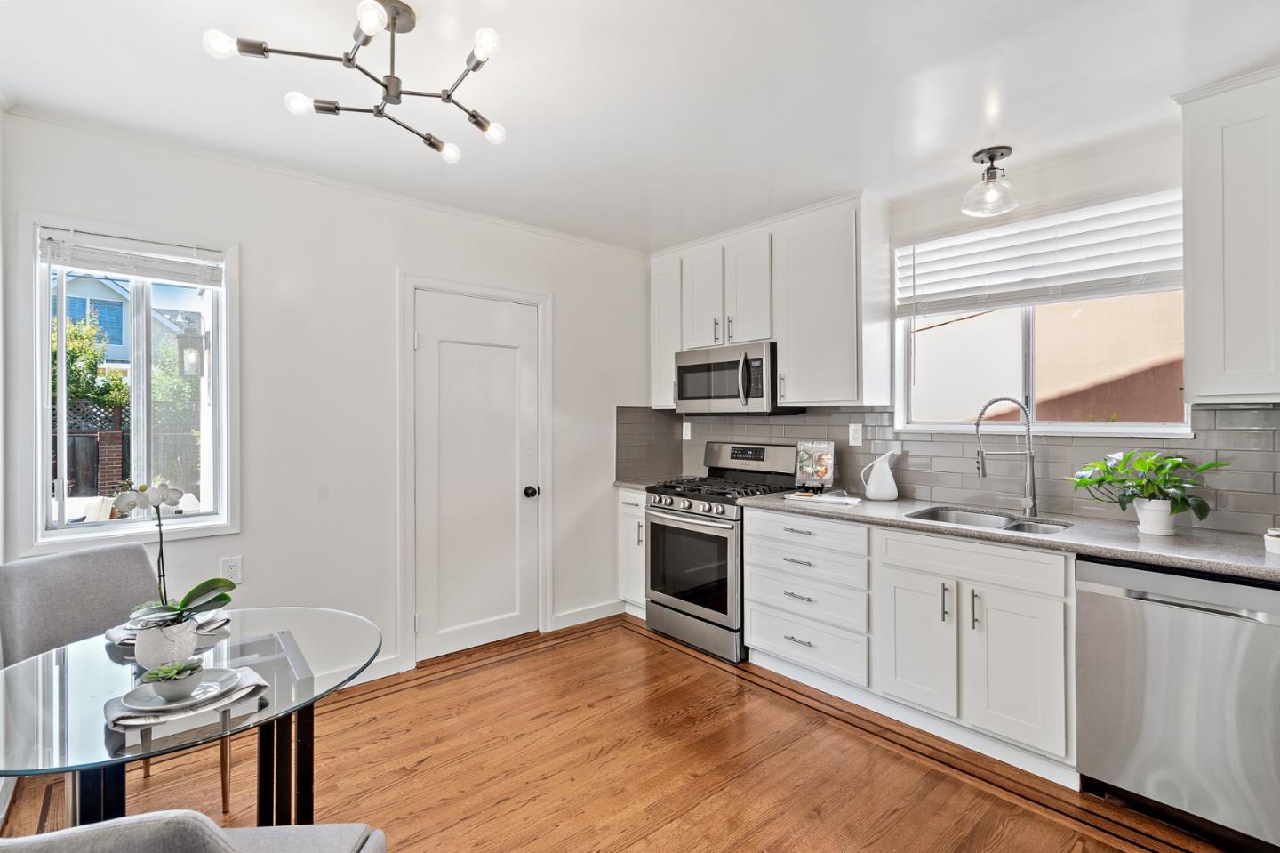 2218 Hale Drive Burlingame, CA 94010 - Photo 14 of 45 a kitchen with stainless steel appliances granite countertop a stove sink and cabinets