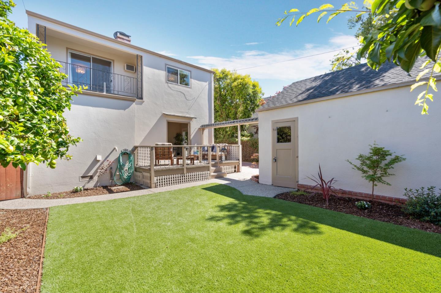 2218 Hale Drive Burlingame, CA 94010 - Photo 36 of 45 a view of a patio with table and chairs potted plants and large tree