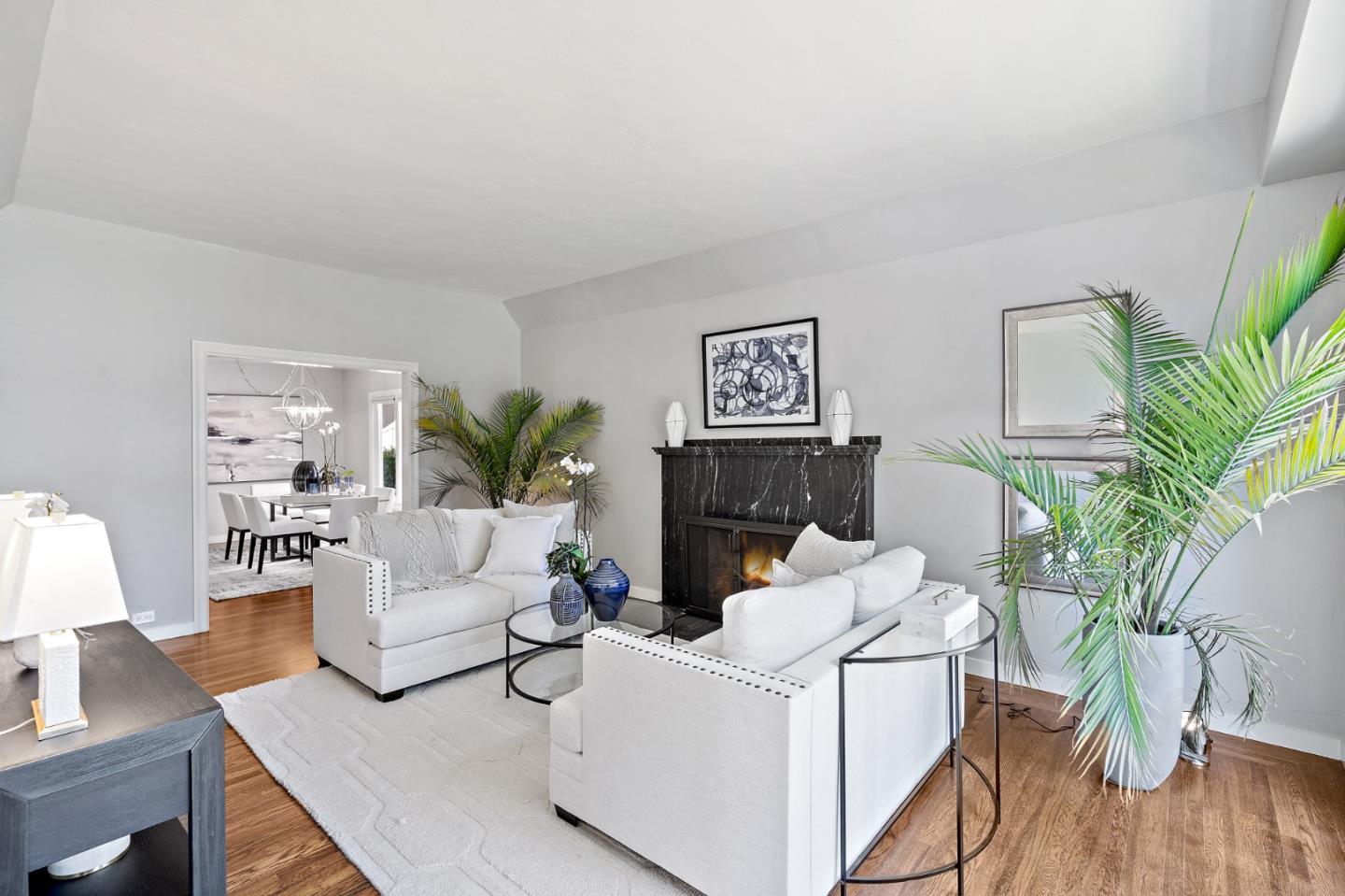 2218 Hale Drive Burlingame, CA 94010 - Photo 10 of 45 a living room with furniture a potted plant and a fireplace