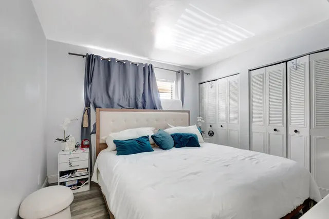 a bedroom with a bed and a dresser