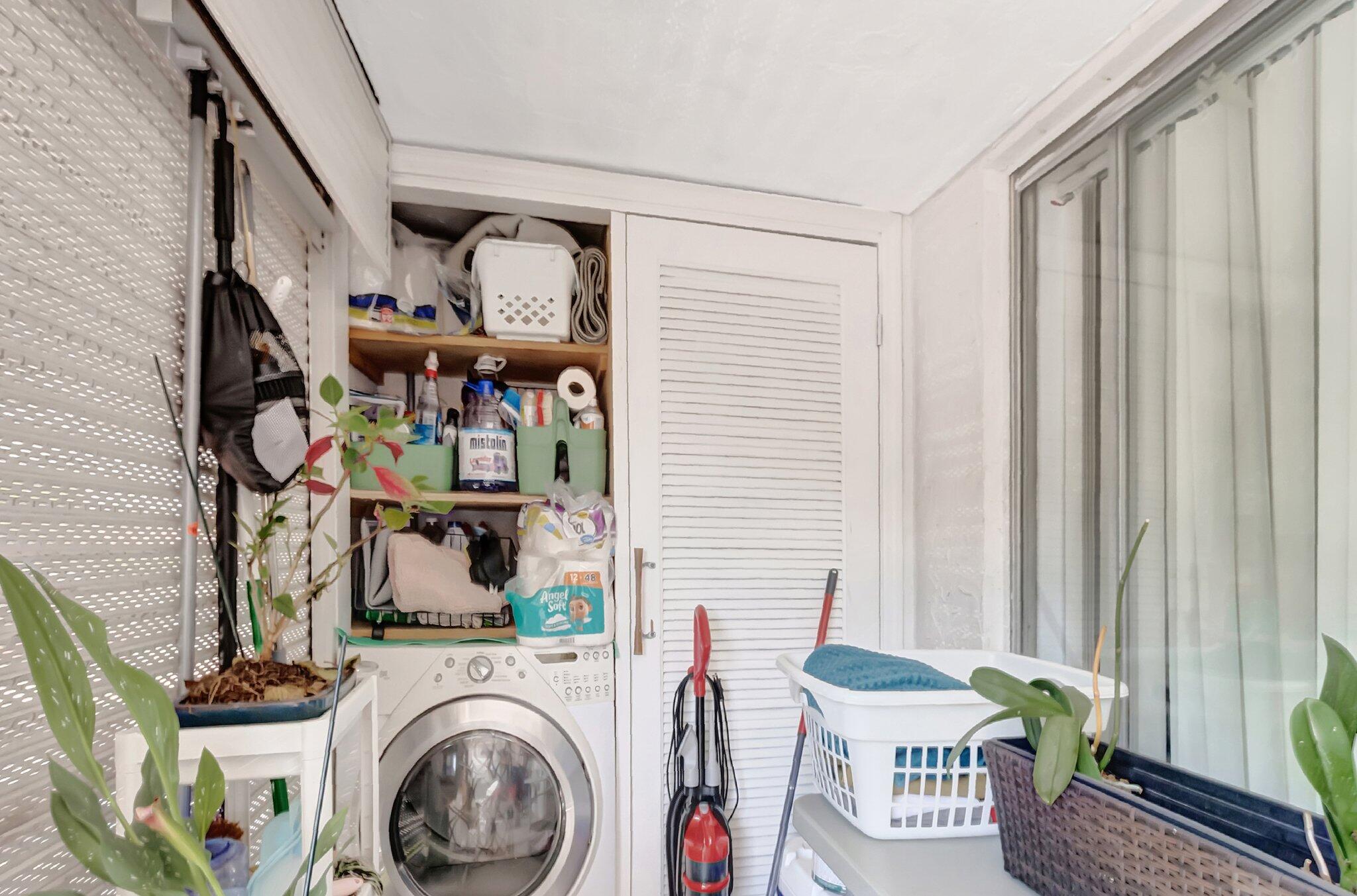 1124 Northwest 13th Street, Unit 208 Boca Raton, FL 33486 - Photo 20 of 23 a view of living room washer and dryer