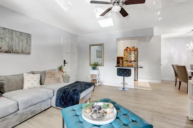 a living room with furniture and a table