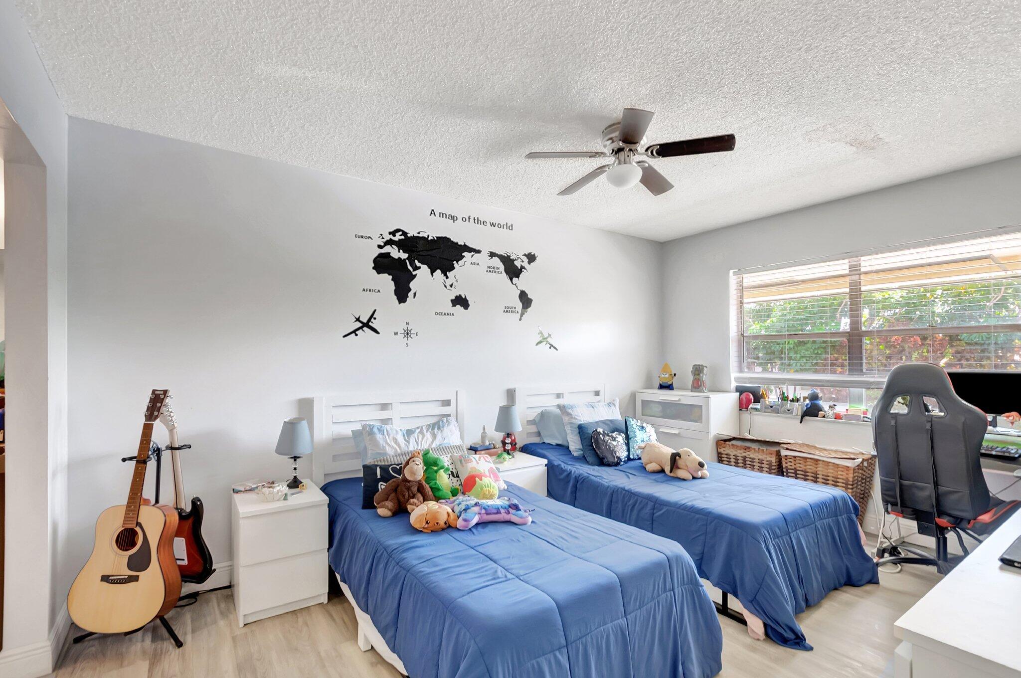 1124 Northwest 13th Street, Unit 208 Boca Raton, FL 33486 - Photo 10 of 23 a view of a workspace with furniture and a window