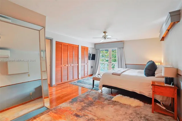 a bedroom with furniture and window