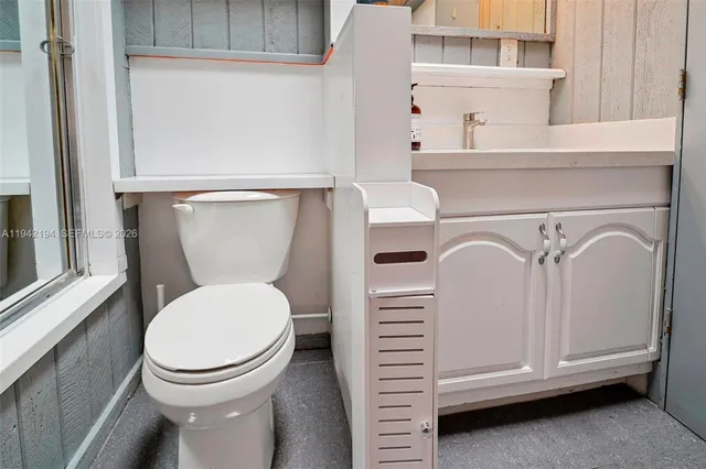 a close view of a utility room with dryer and washer