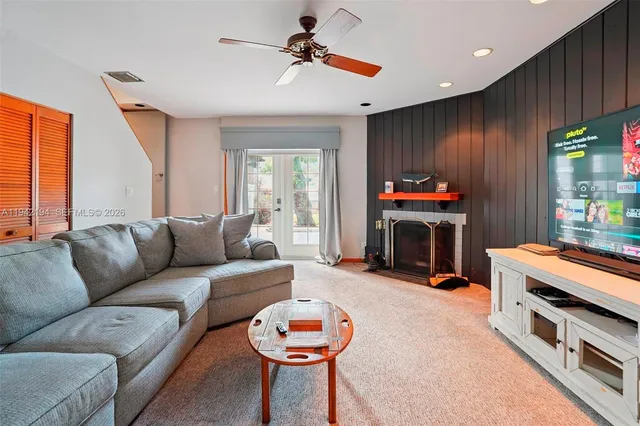 a living room with furniture a window and a fireplace