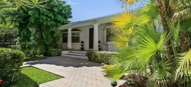a view of a backyard with plants