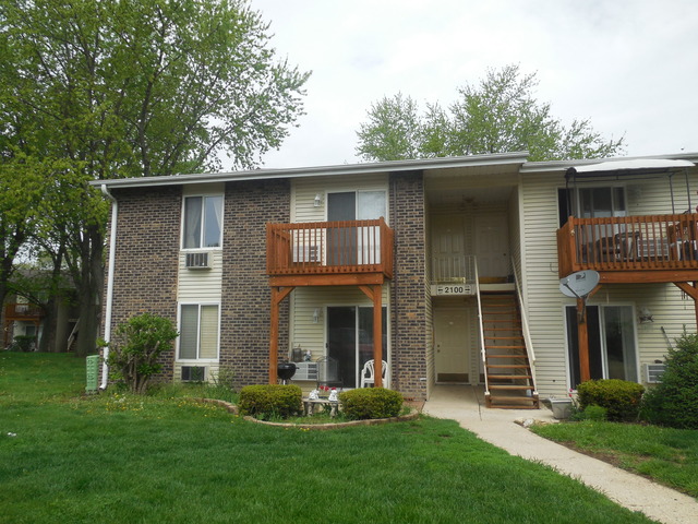 2100 Light Road, Unit 207 Oswego, IL 60543 - Photo 1 of 14 front view of a house with a yard