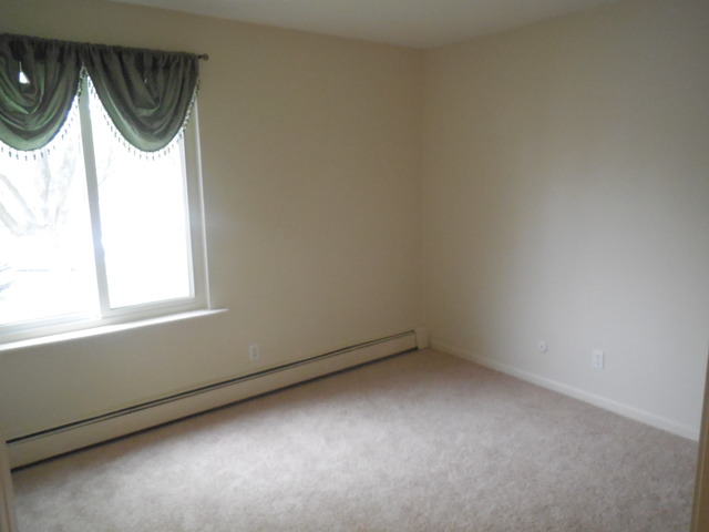 2100 Light Road, Unit 207 Oswego, IL 60543 - Photo 13 of 14 an empty room with a window