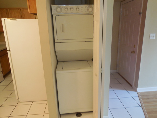 2100 Light Road, Unit 207 Oswego, IL 60543 - Photo 6 of 14 a utility room with dryer and washer
