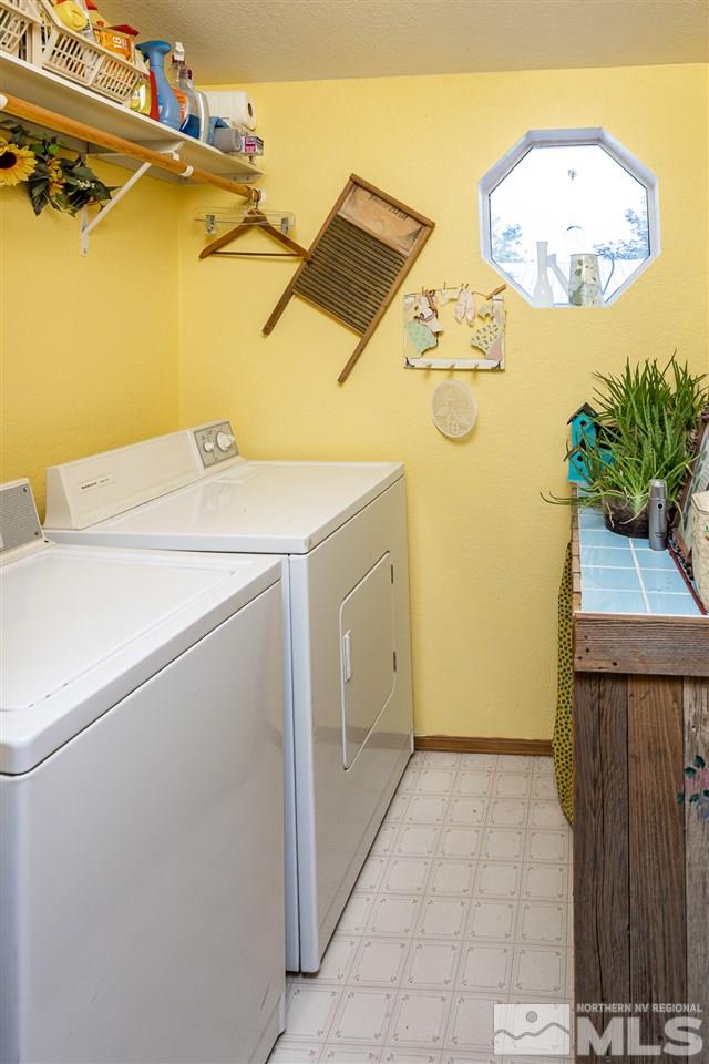 2751 Larkspur Street Reno, NV 89512 - Photo 24 of 24 a utility room with dryer and washer
