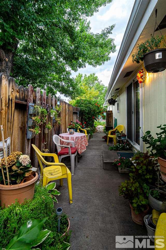 2751 Larkspur Street Reno, NV 89512 - Photo 8 of 24 a view of a backyard with plants and chairs