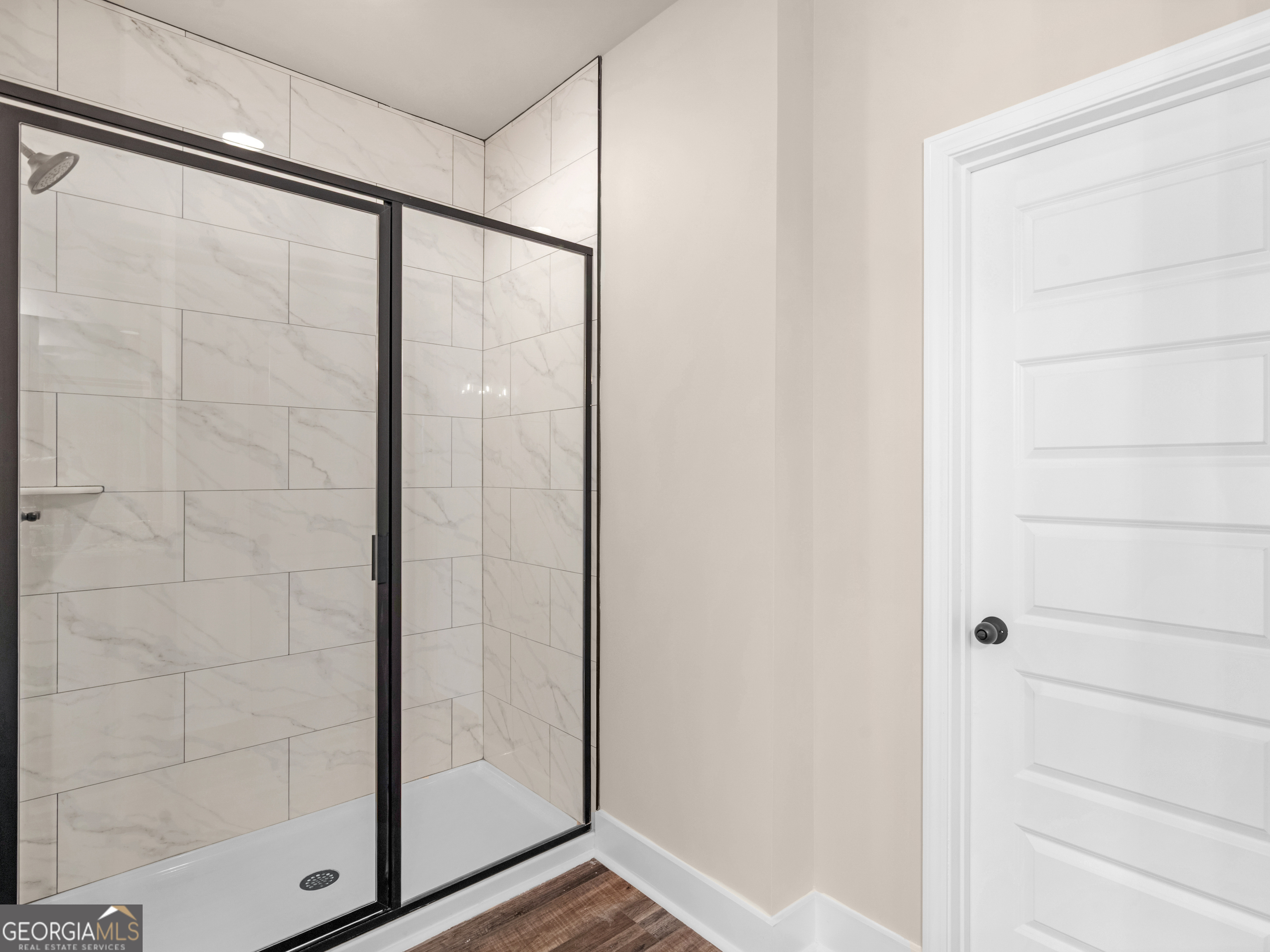 160 Loyd Road Mansfield, GA 30056 - Photo 46 of 53 a bathroom with a glass shower door