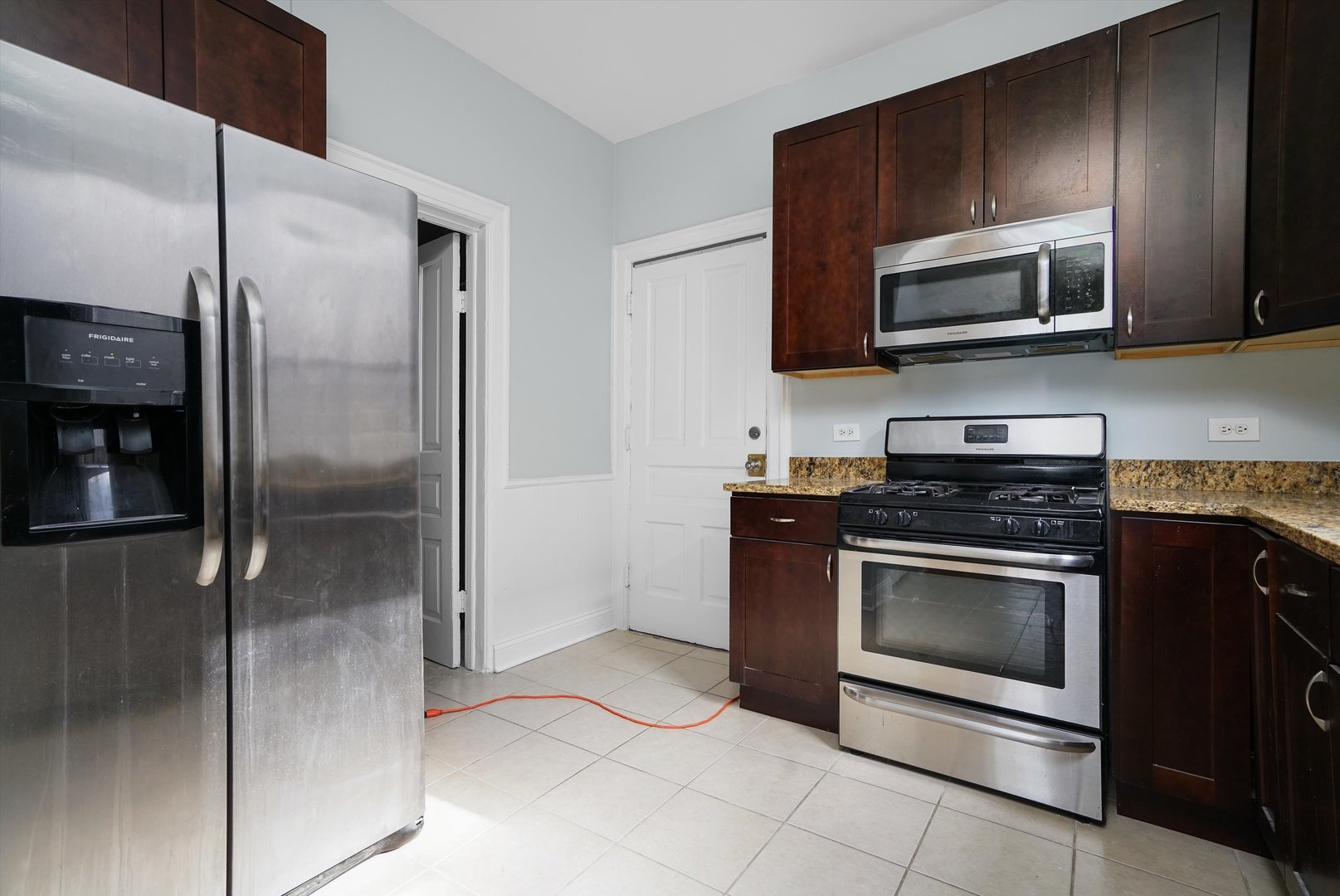 Undisclosed Address Chicago, IL 60622 - Photo 13 of 17 a kitchen with stainless steel appliances granite countertop a refrigerator and a stove top oven