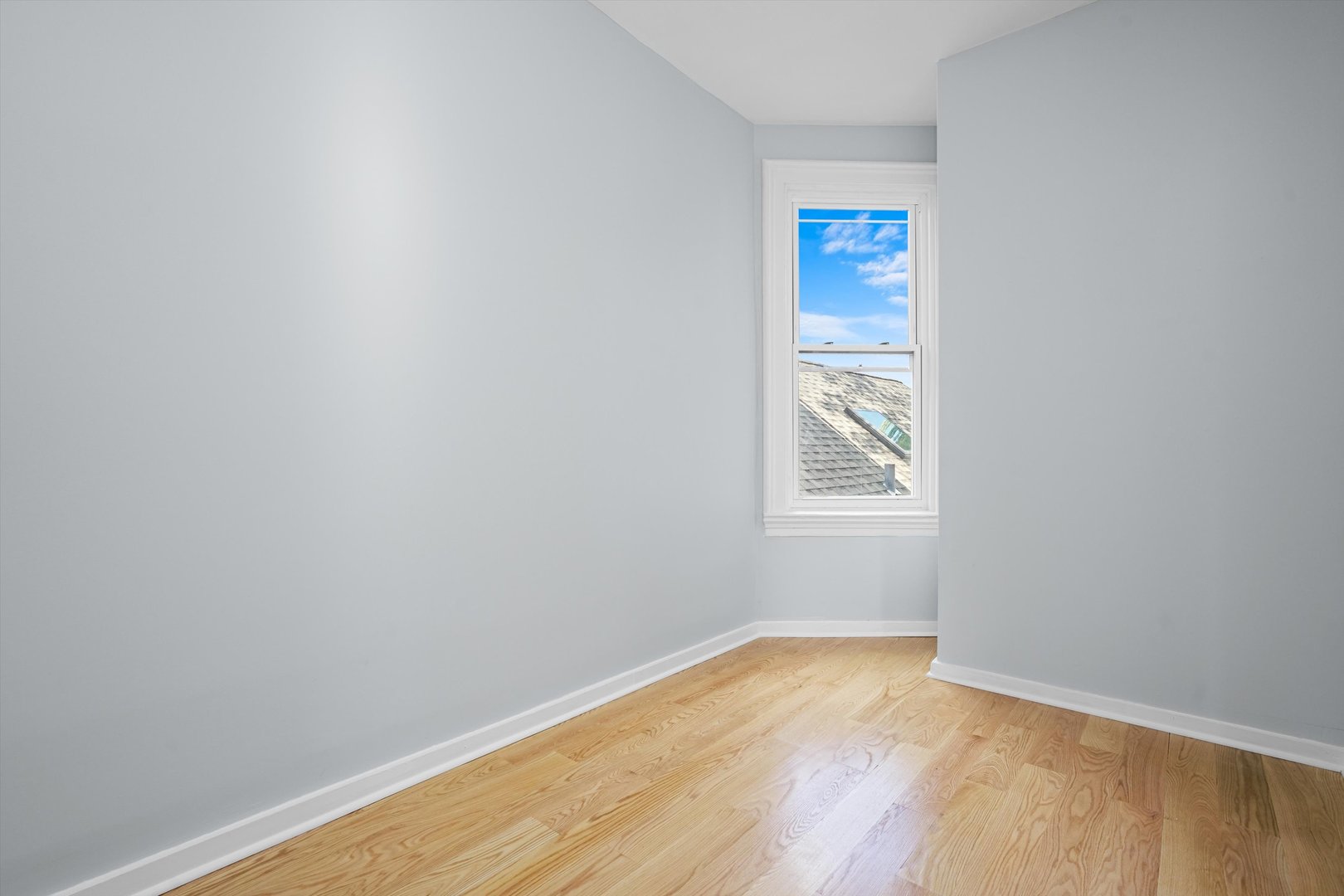 Undisclosed Address Chicago, IL 60622 - Photo 16 of 17 a view of an empty room with wooden floor and a window