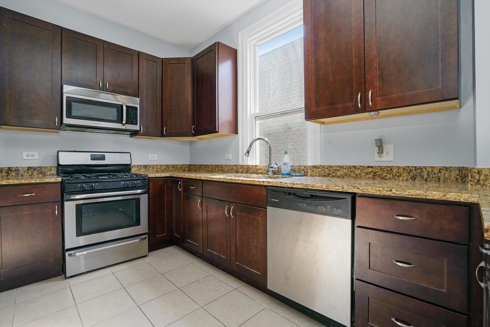 Undisclosed Address Chicago, IL 60622 - Photo 8 of 17 a kitchen with granite countertop cabinets stainless steel appliances and a sink