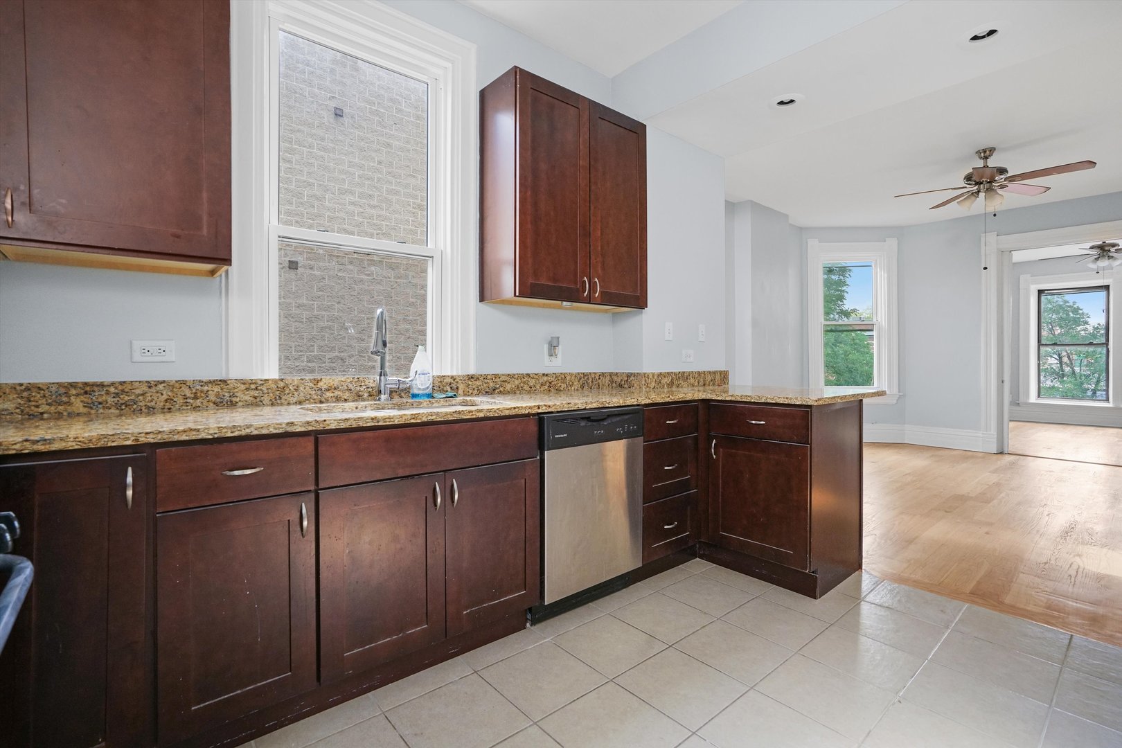 Undisclosed Address Chicago, IL 60622 - Photo 9 of 17 a spacious bathroom with a granite countertop sink and a mirror