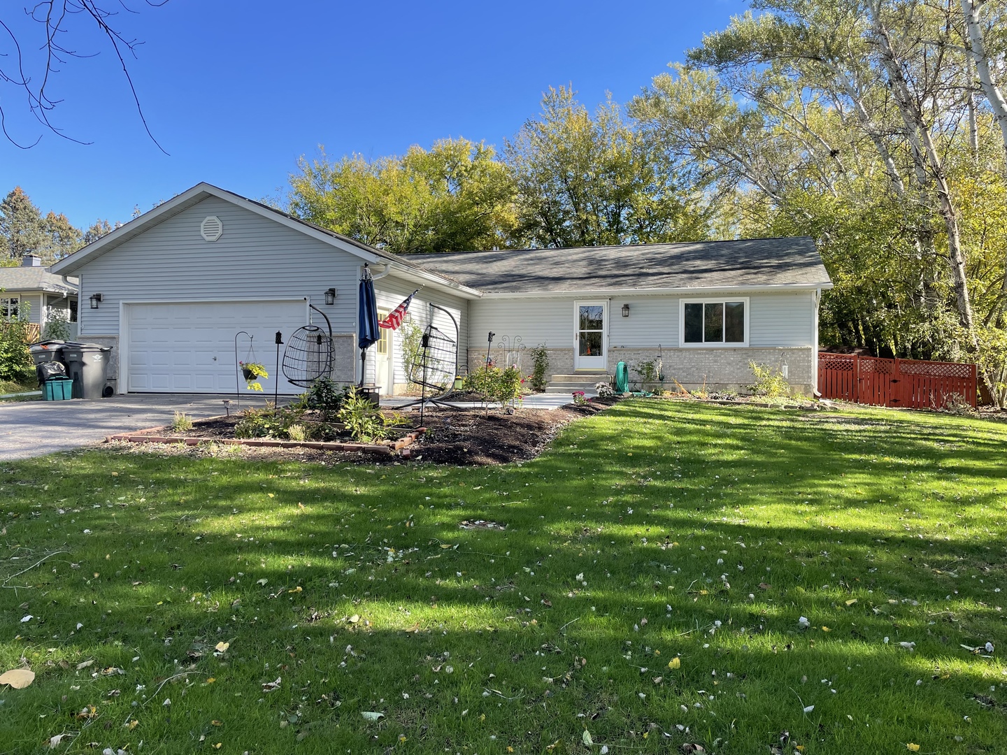 33582 North State Road Genoa, IL 60135 - Photo 2 of 21 a front view of house with yard and trees
