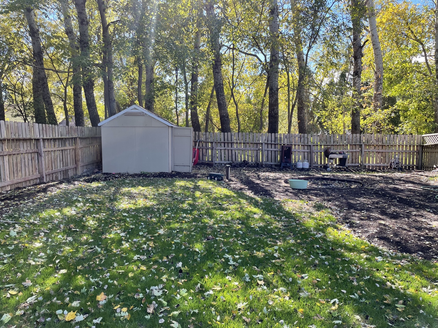 33582 North State Road Genoa, IL 60135 - Photo 21 of 21 a view of a house with a small yard and large trees