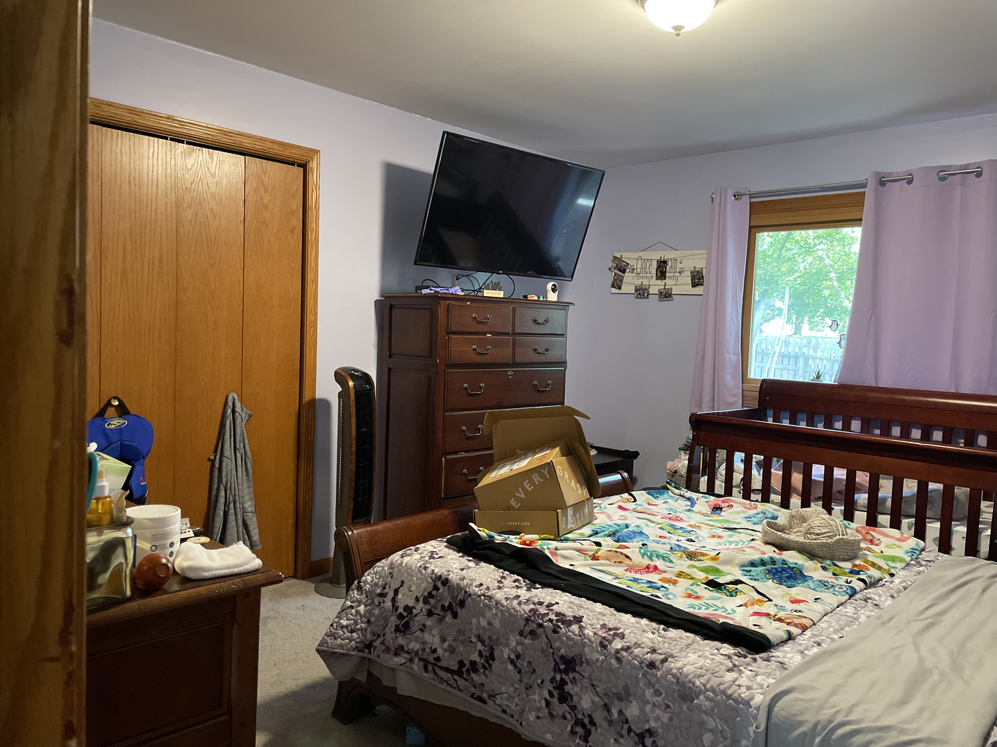 33582 North State Road Genoa, IL 60135 - Photo 8 of 21 a bedroom with a bed and a flat screen tv