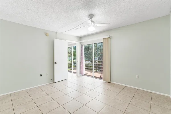 a view of a kitchen with a sink and a ceiling fan