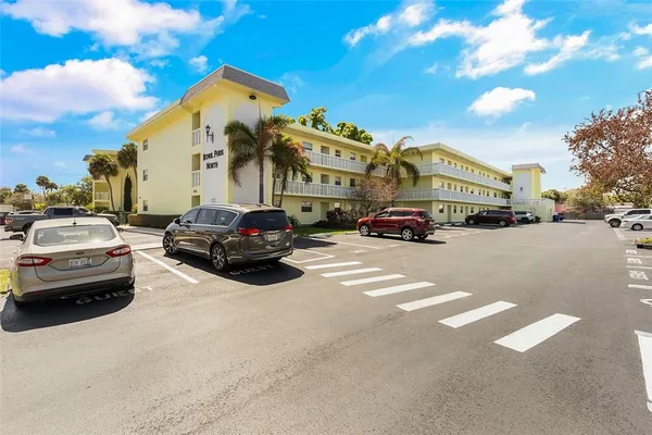 a couple of cars parked in front of a house