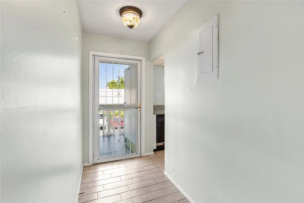 a view of hallway with wooden floor