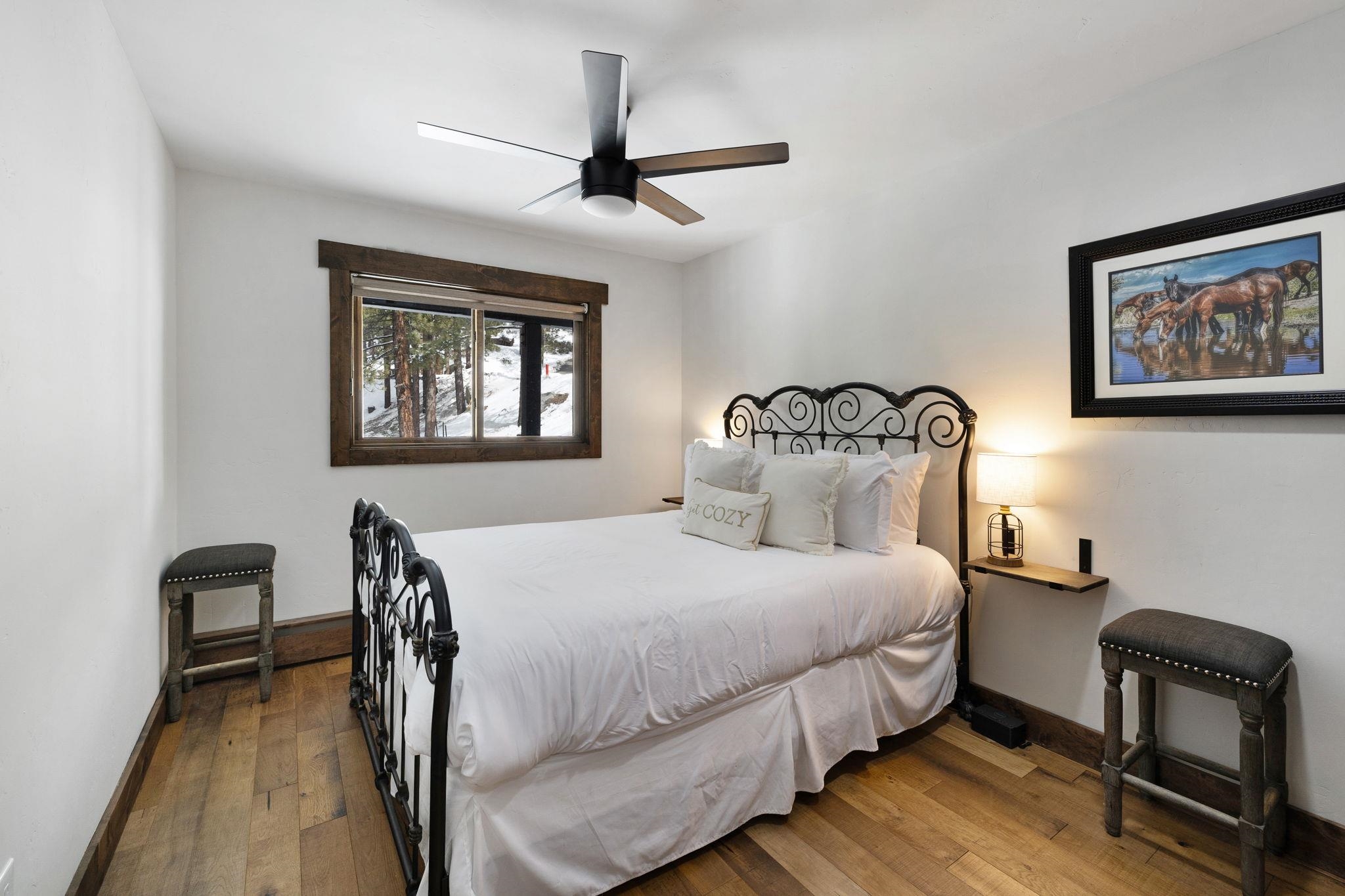 520 Laurel Lane Stateline, NV 89449 - Photo 17 of 27 a bedroom with a bed a desk and chair