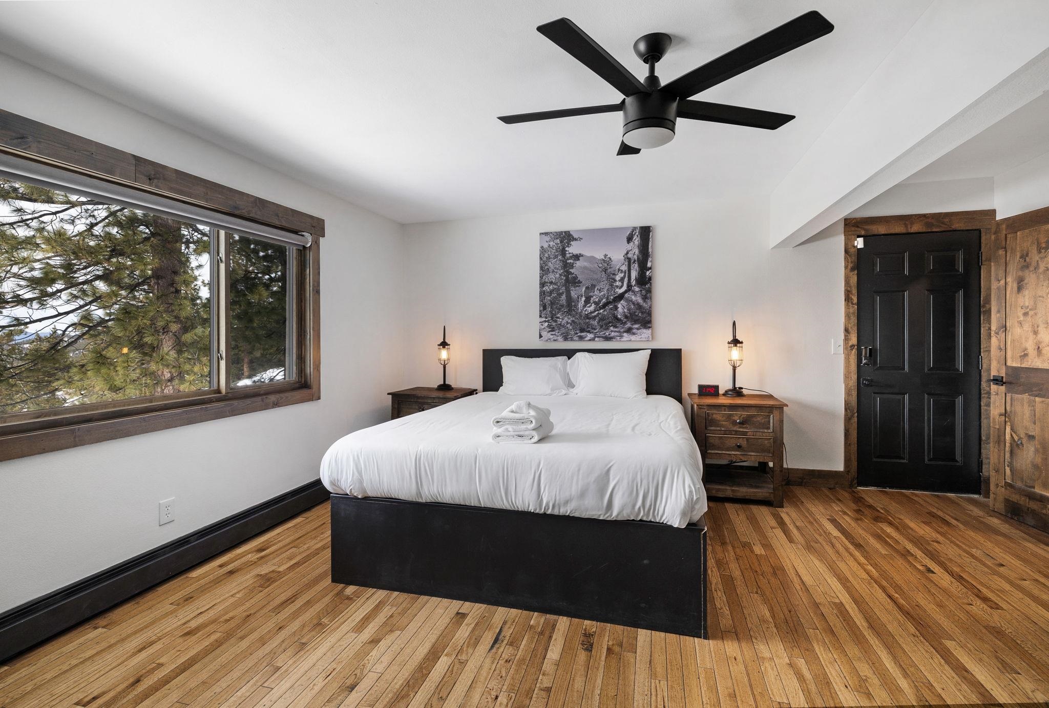 520 Laurel Lane Stateline, NV 89449 - Photo 21 of 27 a bedroom with a bed and a large window