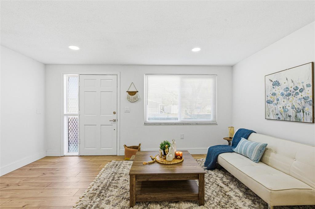 6338 Nashua Drive Port Richey, FL 34668 - Photo 11 of 49 a living room with furniture and window