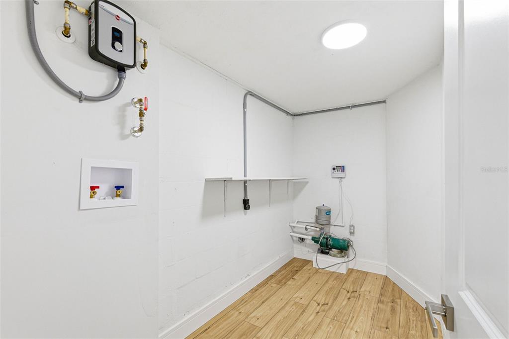 6338 Nashua Drive Port Richey, FL 34668 - Photo 27 of 49 a view of a storage & utility room with a window