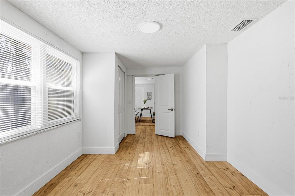 6338 Nashua Drive Port Richey, FL 34668 - Photo 29 of 49 a view of empty room with wooden floor