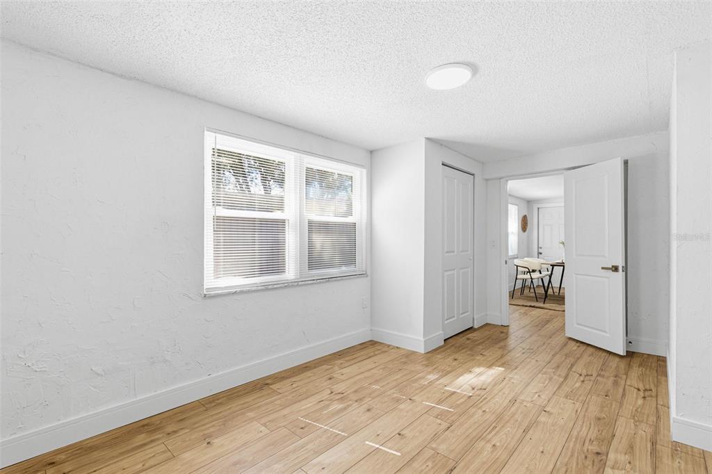 6338 Nashua Drive Port Richey, FL 34668 - Photo 30 of 49 a view of empty room with wooden floor and fan