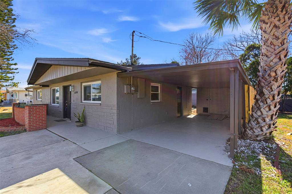 6338 Nashua Drive Port Richey, FL 34668 - Photo 35 of 49 a front view of a house with a yard