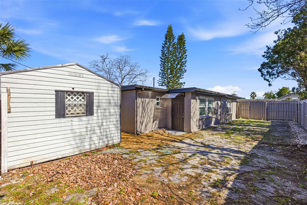 6338 Nashua Drive Port Richey, FL 34668 - Photo 37 of 49 a blue house with yard in front of it
