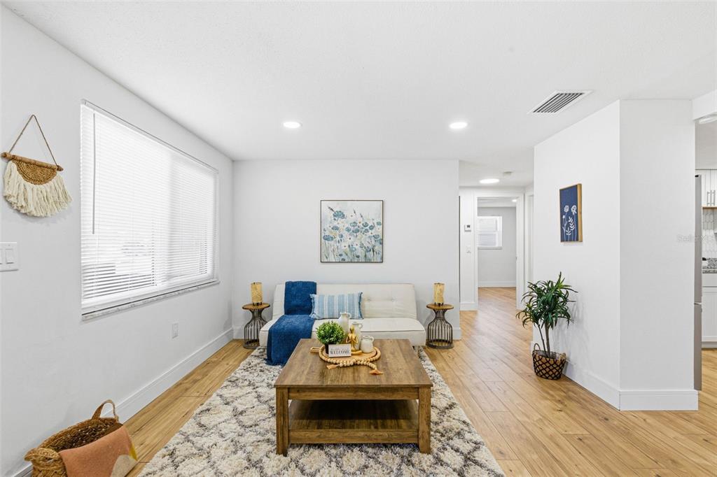 6338 Nashua Drive Port Richey, FL 34668 - Photo 9 of 49 a living room with furniture and a potted plant