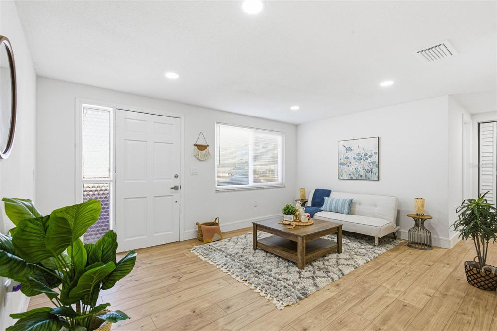 6338 Nashua Drive Port Richey, FL 34668 - Photo 10 of 49 a living room with furniture and a potted plant