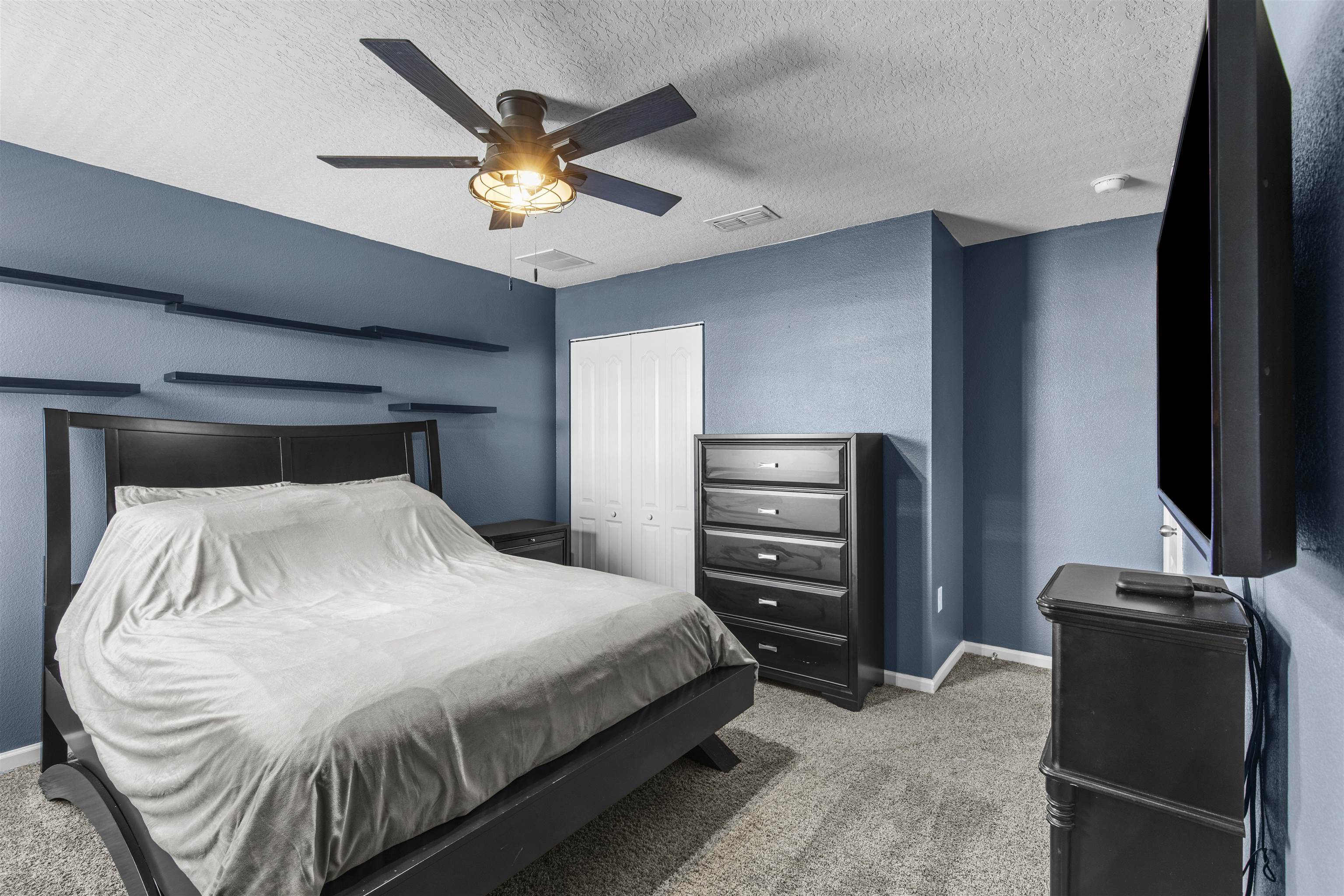 266 Caminha Road St. Augustine, FL 32084 - Photo 31 of 59 a bedroom with a bed and ceiling fan
