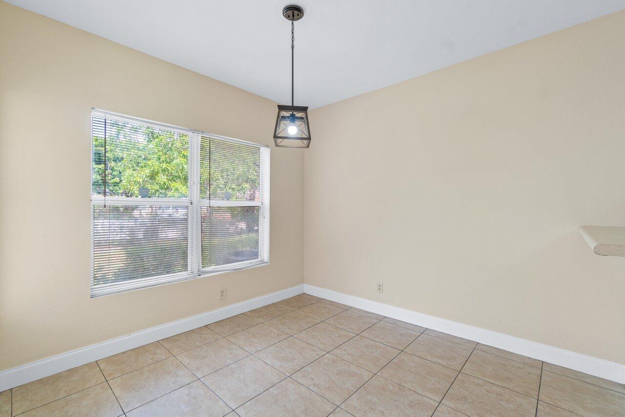 809 Talia Circle, Unit 809 TALIA CIRCLE Palm Springs, FL 33461 - Photo 8 of 23 a view of an empty room with a window