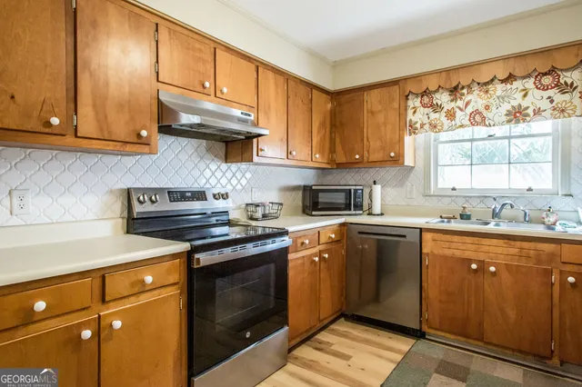 a view of living room with furniture and fireplace