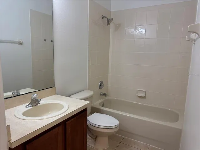 a bathroom with a sink toilet tub and shower
