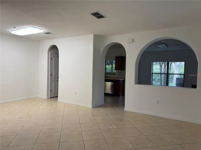 a view of empty room with windows