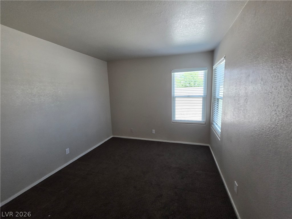 2275 Ramsgate Drive Henderson, NV 89074 - Photo 78 of 84 A quiet retreat with dark carpeting and bright window light offers comfort.