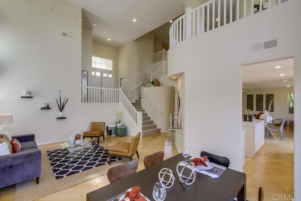 2727 Carriagedale Row La Jolla, CA 92037 - Photo 2 of 25 a bedroom with furniture and a wooden floor