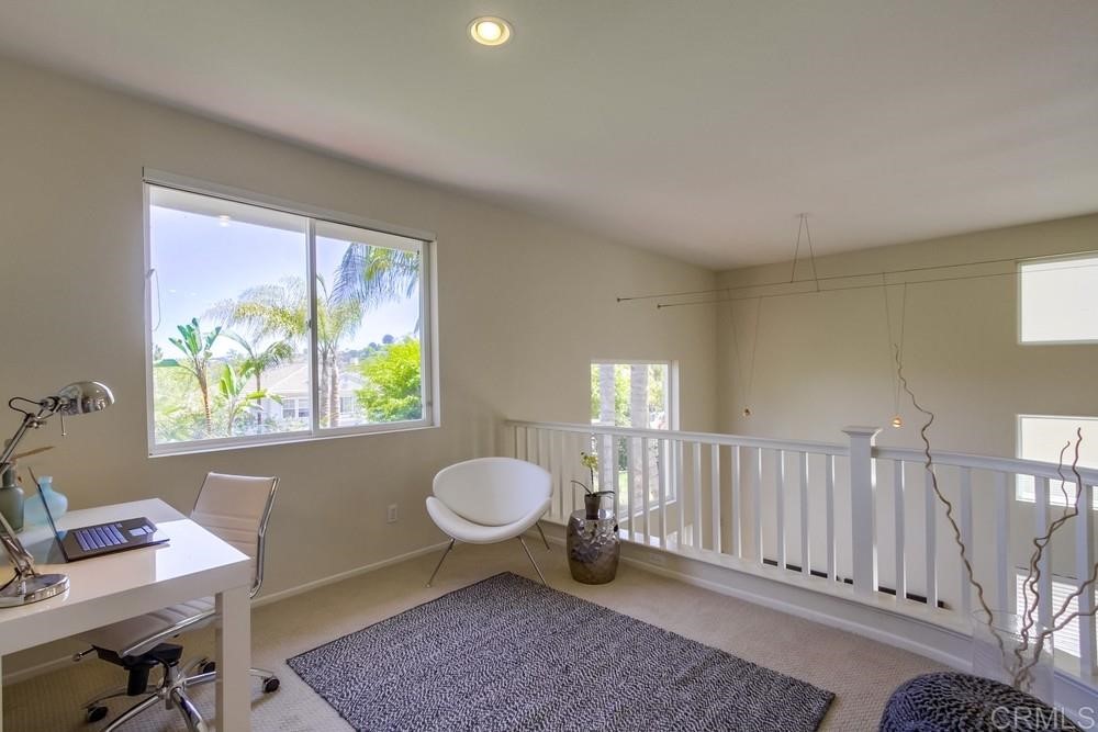 2727 Carriagedale Row La Jolla, CA 92037 - Photo 11 of 25 a spacious bedroom with a bed and a window