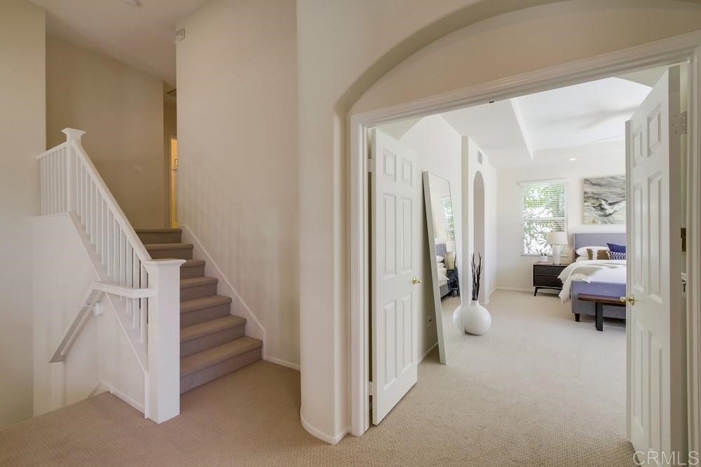 2727 Carriagedale Row La Jolla, CA 92037 - Photo 12 of 25 a view of a hallway with couch and entryway