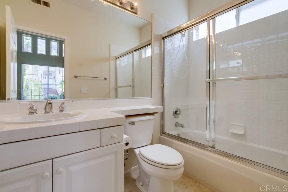2727 Carriagedale Row La Jolla, CA 92037 - Photo 18 of 25 a bathroom with a sink toilet and shower