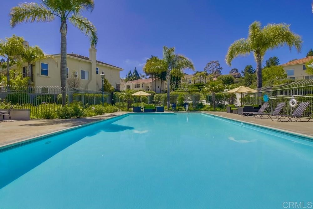 2727 Carriagedale Row La Jolla, CA 92037 - Photo 25 of 25 a front view of a house with a yard and swimming pool