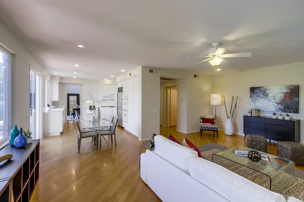 2727 Carriagedale Row La Jolla, CA 92037 - Photo 5 of 25 a living room with furniture and a chandelier