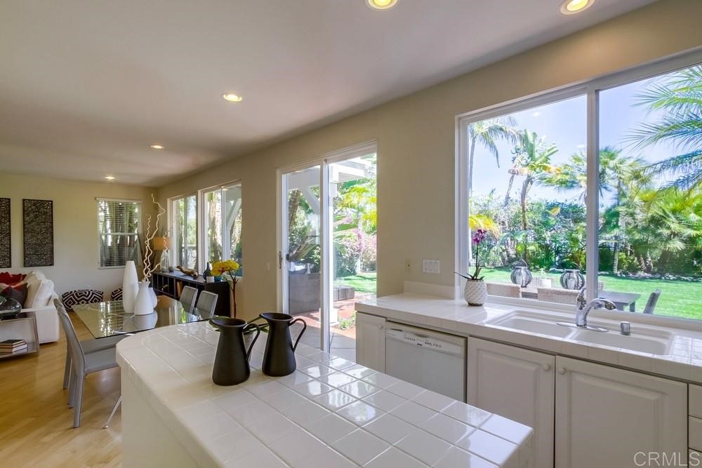 2727 Carriagedale Row La Jolla, CA 92037 - Photo 9 of 25 a kitchen with a large window and sink